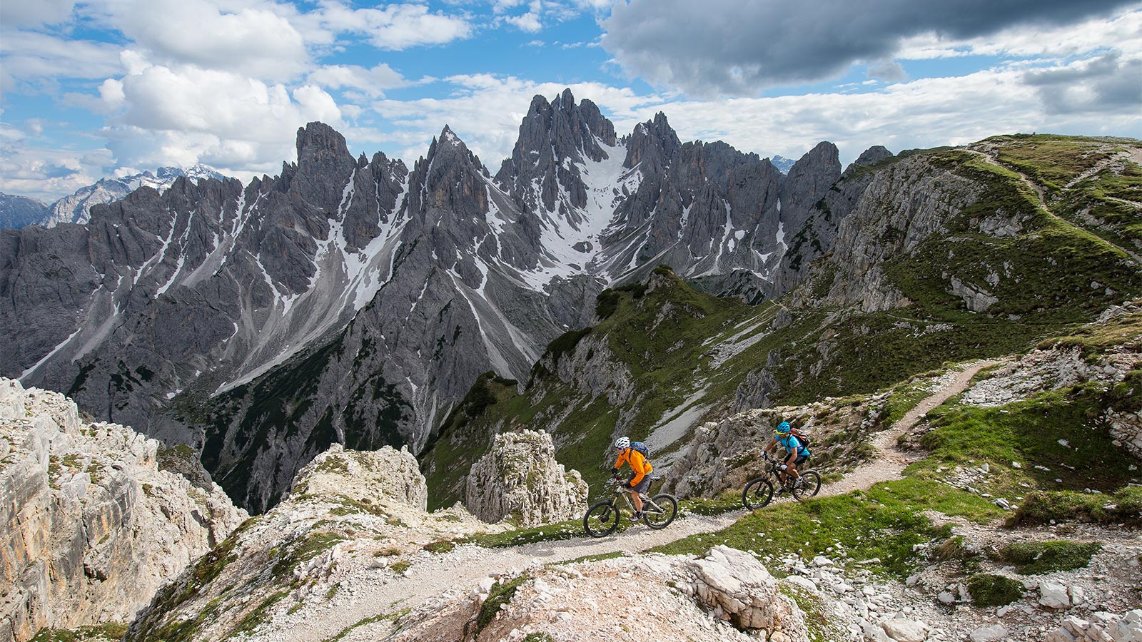 Tourists enjoy a day in the mountains with the bike rental in Badia