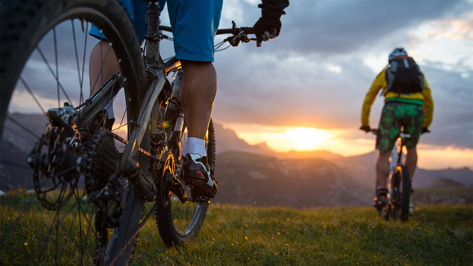 Cyclists enjoy the sunset over an idyllic landscape